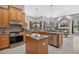 Kitchen with granite countertops, stainless steel appliances, and an adjacent living space at 111 Falling Water Dr, Brandon, FL 33511