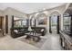 Elegant living room featuring a large sectional, decorative arches, and lots of natural light at 111 Falling Water Dr, Brandon, FL 33511