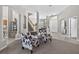 An open concept living room with view of the stairway, dining area and front entrance at 111 Falling Water Dr, Brandon, FL 33511