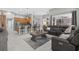 Open-concept living room with a large sectional sofa next to the kitchen and dining area at 111 Falling Water Dr, Brandon, FL 33511