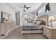 Bright and airy main bedroom with light neutral colors and carpet flooring at 111 Falling Water Dr, Brandon, FL 33511