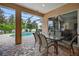 Screened patio with dining table for six looks onto pool area for a relaxing outdoor experience at 111 Falling Water Dr, Brandon, FL 33511