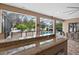 Granite topped outdoor kitchen bar overlooks screened pool area with plentiful seating and outdoor cooking spaces at 111 Falling Water Dr, Brandon, FL 33511