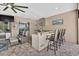 Outdoor living space with bar seating and a view of the entertainment area with TV at 111 Falling Water Dr, Brandon, FL 33511