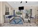 Comfortable outdoor living area featuring plush seating, an area rug, and a view of the pool at 111 Falling Water Dr, Brandon, FL 33511