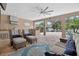 Inviting outdoor living space with comfortable seating and a fully equipped kitchen, perfect for relaxation at 111 Falling Water Dr, Brandon, FL 33511