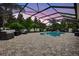 This backyard kidney-bean pool and lanai has ample space for relaxing and entertaining by the pool at 111 Falling Water Dr, Brandon, FL 33511