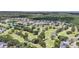 Scenic aerial view of a golf course community with lush greenery and tranquil ponds at 11222 Clayridge Dr, Tampa, FL 33635