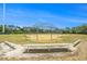 View of the community baseball field with covered dugouts at 11222 Clayridge Dr, Tampa, FL 33635