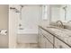 Bright bathroom featuring granite countertops, tub shower and vanity at 11222 Clayridge Dr, Tampa, FL 33635