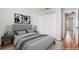 Staged bedroom featuring modern decor, wood-look floors and double closet at 11222 Clayridge Dr, Tampa, FL 33635