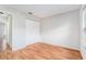 Bedroom with wood-look floors, closet and neutral wall color at 11222 Clayridge Dr, Tampa, FL 33635