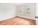 Bedroom with wood floors and a bright window at 11222 Clayridge Dr, Tampa, FL 33635