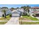 Charming single-story home featuring a well-manicured lawn, a two-car garage, and a welcoming front entrance at 11222 Clayridge Dr, Tampa, FL 33635