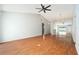 Bright and open living area with wood-look floors, vaulted ceilings, and neutral paint at 11222 Clayridge Dr, Tampa, FL 33635