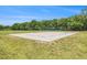 Sand volleyball court with a net in place, ready for recreational play in a well-maintained park setting at 11222 Clayridge Dr, Tampa, FL 33635