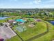 Aerial view showcasing community pool, playground, basketball court, and green spaces at 11429 Drifting Leaf Dr, Riverview, FL 33579
