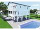 Charming two-story house featuring a private pool and balconies for optimal outdoor enjoyment at 131 92Nd Ave, Treasure Island, FL 33706