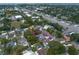 Aerial view of home with mature landscaping, conveniently located near major roads and amenities at 13514 Oval W Dr, Largo, FL 33774