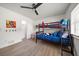 Bedroom featuring a bunk bed, closet, and natural light from the window at 13514 Oval W Dr, Largo, FL 33774