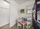 Bedroom featuring a bunk bed, closet, small table and chairs, and natural light at 13514 Oval W Dr, Largo, FL 33774
