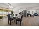 Inviting dining room showcases backyard access, modern lighting, and an open-concept design at 13514 Oval W Dr, Largo, FL 33774