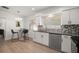 Modern kitchen features stainless steel appliances, and sleek countertops, creating a functional space at 13514 Oval W Dr, Largo, FL 33774