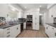 Updated kitchen features modern appliances, sleek countertops, and ample cabinet space at 13514 Oval W Dr, Largo, FL 33774