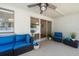 Covered patio featuring comfortable seating, ceiling fan, and access to backyard at 13514 Oval W Dr, Largo, FL 33774
