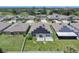 Aerial view of the house highlighting its solar panels on the roof and spacious backyard within a community at 146 Rain Berry Ave, Ruskin, FL 33570