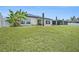 Spacious yard with white privacy fence, lush landscaping and plenty of room to roam at 146 Rain Berry Ave, Ruskin, FL 33570