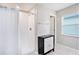 Modern bathroom with walk-in shower and neutral color palette at 146 Rain Berry Ave, Ruskin, FL 33570