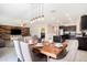 Open floorplan with dining area connected to modern kitchen with stainless steel appliances at 146 Rain Berry Ave, Ruskin, FL 33570