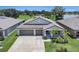 Beautiful single-story home with a three-car garage and well-maintained landscaping in a desirable neighborhood at 146 Rain Berry Ave, Ruskin, FL 33570