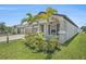 Charming single-story home with well-maintained landscaping, a symmetrical facade and a spacious two-car garage at 146 Rain Berry Ave, Ruskin, FL 33570