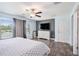Bright main bedroom features wood flooring, neutral paint, and natural light at 146 Rain Berry Ave, Ruskin, FL 33570
