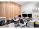 Bright office space with wood accent wall, offering a functional area with plenty of storage and natural light at 146 Rain Berry Ave, Ruskin, FL 33570