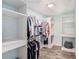 Walk-in closet boasts custom shelving and ample storage space at 146 Rain Berry Ave, Ruskin, FL 33570