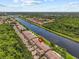 Expansive aerial showing the property's prime location along the river and well-manicured landscape at 1622 Lago Vista Blvd, Palm Harbor, FL 34685