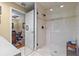Bathroom with standup shower with modern fixtures and a glass door and hardwood flooring at 1622 Lago Vista Blvd, Palm Harbor, FL 34685