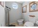 Unique bathroom with a scale, a bidet, and decorative artwork, combining function with distinctive style at 1622 Lago Vista Blvd, Palm Harbor, FL 34685