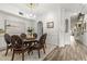 Bright dining room with stylish decor, modern lighting, and an open layout perfect for entertaining guests at 1622 Lago Vista Blvd, Palm Harbor, FL 34685