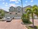 Inviting townhome with a 2 car garage, beautiful tile roof, and lush landscaping, ready for new homeowners at 1622 Lago Vista Blvd, Palm Harbor, FL 34685