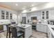 Bright kitchen featuring a quartz island, stainless appliances, and gray cabinetry for a sleek, modern design at 1622 Lago Vista Blvd, Palm Harbor, FL 34685