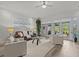 Spacious living area features comfortable seating, large windows, and stylish decor for relaxed living at 1622 Lago Vista Blvd, Palm Harbor, FL 34685