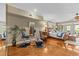 Spacious main bedroom with exercise equipment, hardwood floors, and access to a balcony at 1622 Lago Vista Blvd, Palm Harbor, FL 34685