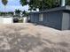 The backyard features white vinyl fencing and a gravel parking area at 1631 St Mary Dr, Dunedin, FL 34698