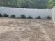 Backyard features a white vinyl fence and pea gravel ground cover at 1631 St Mary Dr, Dunedin, FL 34698