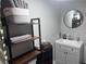 Well-organized bathroom with open shelving for towels and toiletries, complemented by a modern vanity at 1631 St Mary Dr, Dunedin, FL 34698