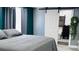 Comfortable bedroom featuring a convenient sliding door, offering privacy and style at 1631 St Mary Dr, Dunedin, FL 34698